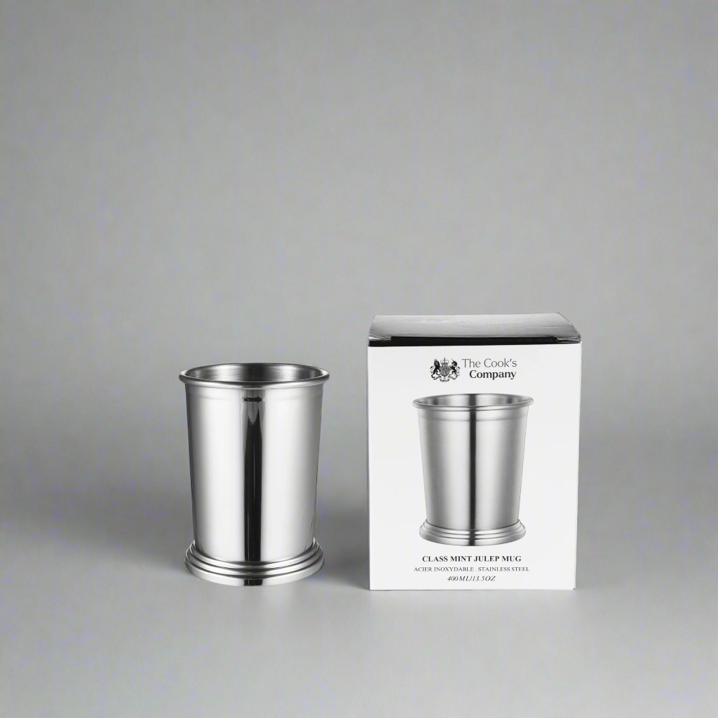 The Cooks Company Mint Julep Cup 400 ml is made from food-grade stainless steel. Elegant, durable, and perfect for cocktails, beer, and chilled drinks.
The Cooks Company Stainless Steel Mint Julep Cup – 400 ml with footed base
Close-up of polished stainless steel julep cup with stepped edge
Classic cocktail cup by The Cooks Company – 400 ml capacity
Side view of mint julep cup on bar counter – The Cooks Company
Stainless steel julep cup filled with mint and ice
Elegant cocktail presentation in The Cook