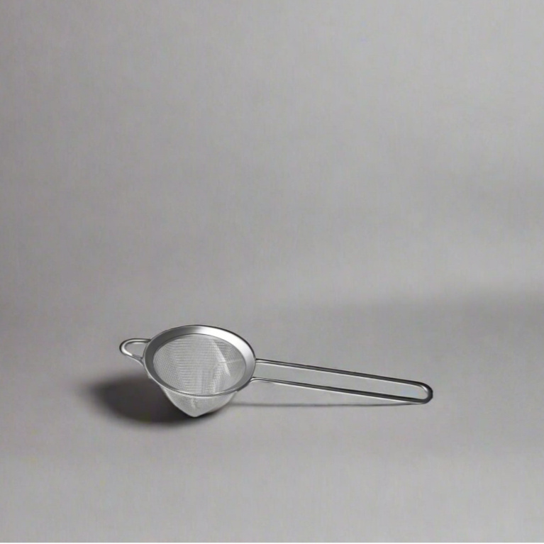 The Cooks Company Stainless Steel Bar Strainer 25.7 cm

Close-up of fine mesh bar strainer by The Cooks Company

Cocktail being strained using The Cooks Company bar tool

Top view of The Cooks Company conical strainer

Rust-resistant stainless steel cocktail strainer – 25.7 cm

Side profile of The Cooks Company bar strainer with long handle

Professional bar tool for straining pulp and seeds