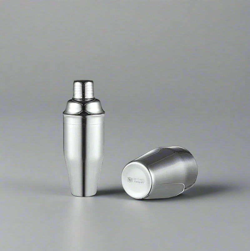 The Cooks Company 700 ml Stainless Steel Cocktail Shaker blends flavors smoothly and chills drinks fast. Ideal for mojitos, margaritas, and more.Stainless Steel Cocktail Shaker – 700 ml

700 ml cocktail shaker with sleek finish by The Cooks Company

Mixing mojito with stainless steel shaker – The Cooks Company

Side view of 700 ml bartender cocktail shaker

Shaker on bar top filled with ice – The Cooks Company

Polished stainless steel drink shaker for home and bar use

The Cooks Company cocktail shaker set